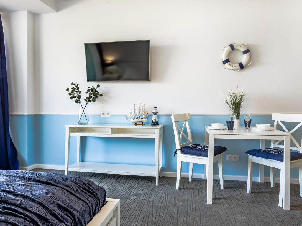 TV a/nebo společenská místnost v ubytování VacationClub – Seaside Apartament 110