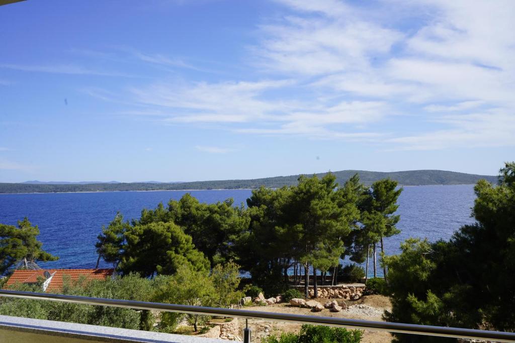 a view of a large body of water with trees at Casa-Gorma at the beach, Apartment 121 in Zavala