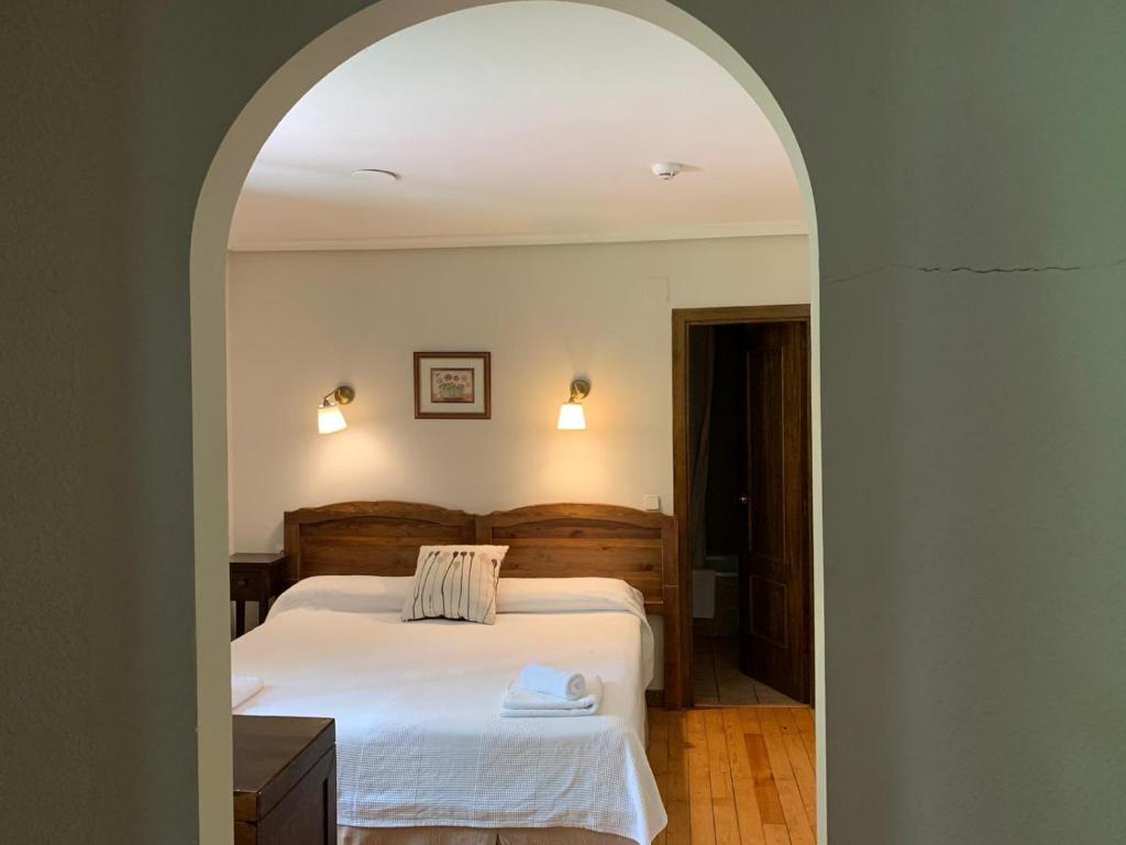 Postel nebo postele na pokoji v ubytování Hotel Charle