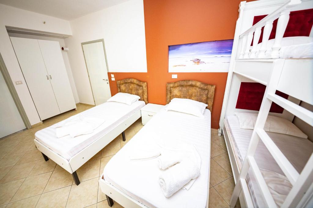 Postel nebo postele na pokoji v ubytování Ideal ApartHotel Saranda