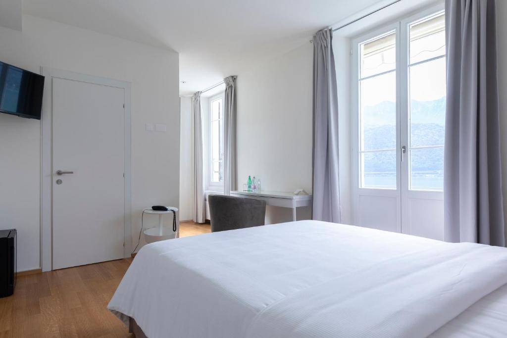 Postel nebo postele na pokoji v ubytování Lac Hotel