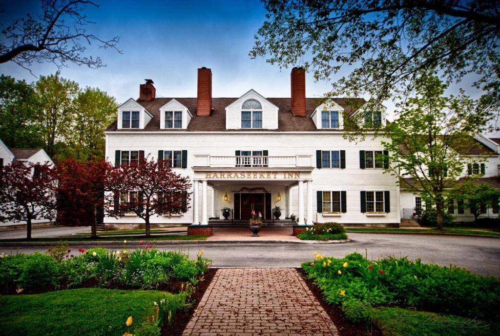 a large white house with a brick driveway at The Harraseeket Inn & Event House in Freeport