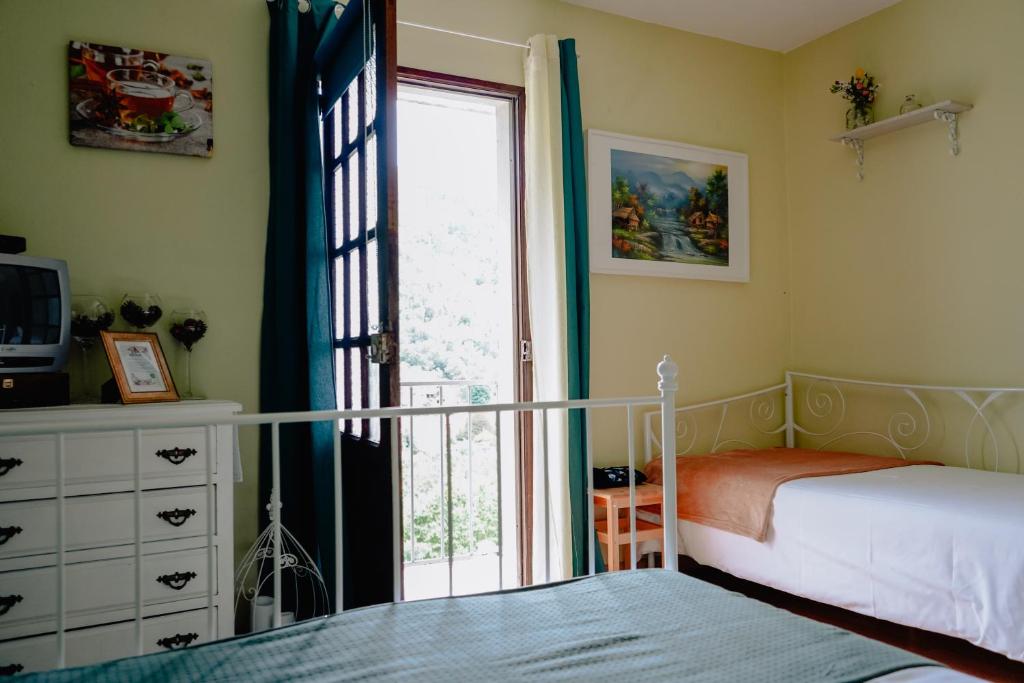 Katil atau katil-katil dalam bilik di Tea House Gerês - T1 Hipericão
