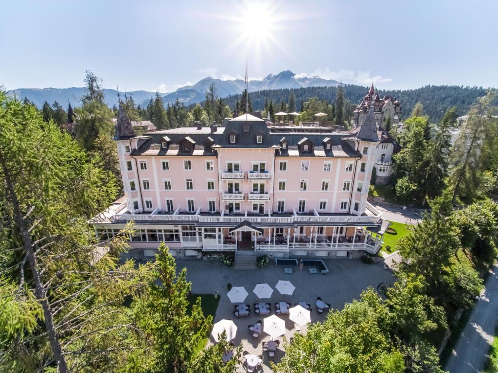 an aerial view of a hotel in the mountains at Romantik Hotel Schweizerhof & Spa in Flims