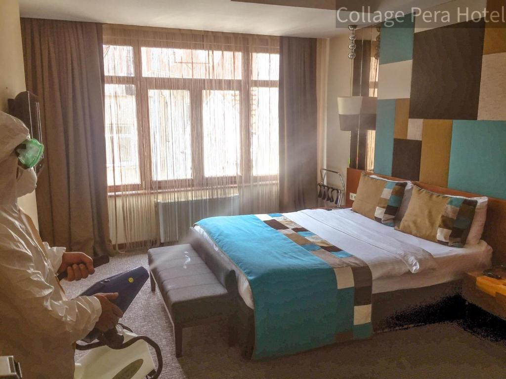 Postel nebo postele na pokoji v ubytování Collage Pera Hotel