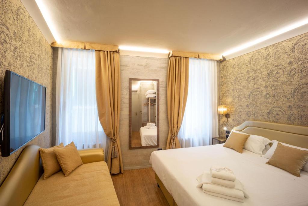 Postel nebo postele na pokoji v ubytování Locanda Cavanella