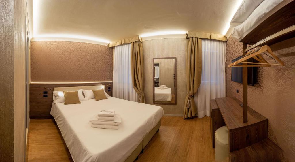 Postel nebo postele na pokoji v ubytování Locanda Cavanella