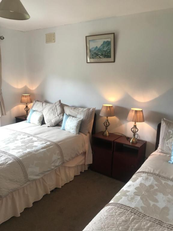 Postel nebo postele na pokoji v ubytování Marguerite's B&B