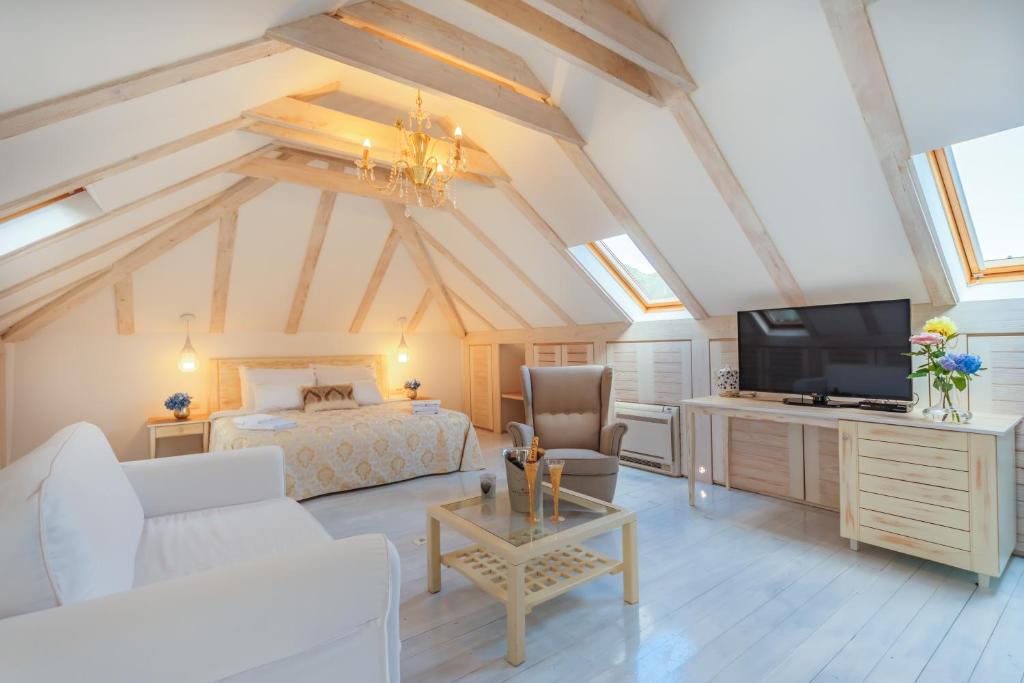 TV a/nebo společenská místnost v ubytování Boutique Hotel Capitano