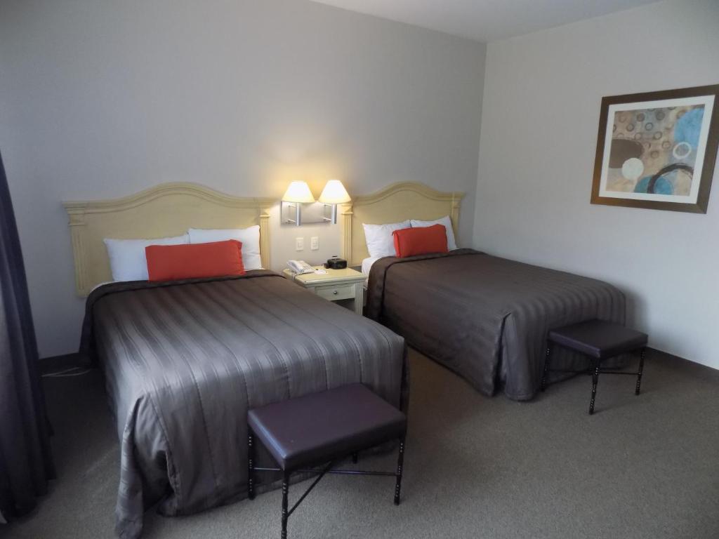 Postel nebo postele na pokoji v ubytování Hotel Real de Minas Bajio