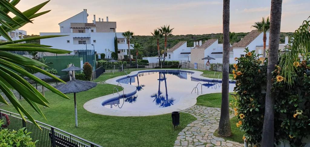an image of a swimming pool at a resort at Golf & Beach La Alcaidesa Terrace in San Roque
