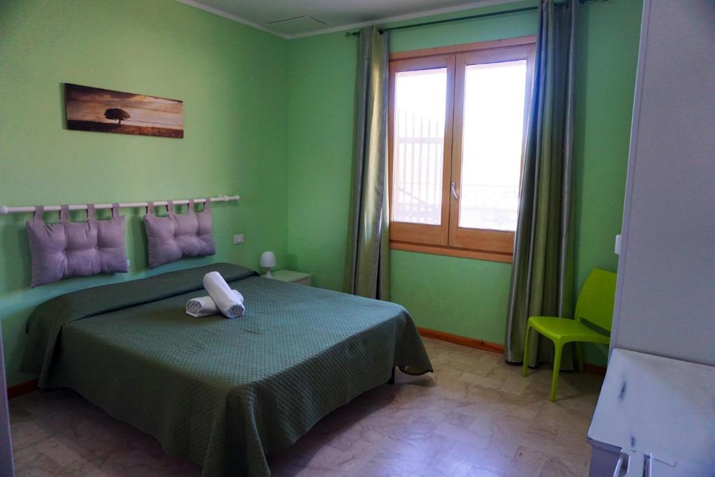 Posteľ alebo postele v izbe v ubytovaní Casa Chiarenza
