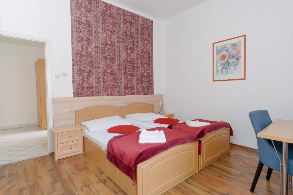 Postel nebo postele na pokoji v ubytování Oázis Panzió