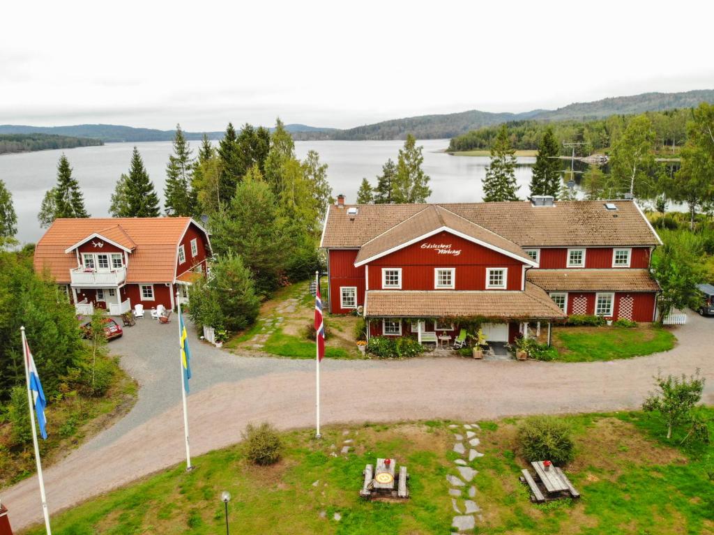 an aerial view of a house with flags in front of it at Edsleskogs Wärdshus in Åmål
