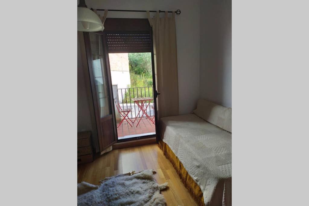 Postel nebo postele na pokoji v ubytování Vivienda Majaceite