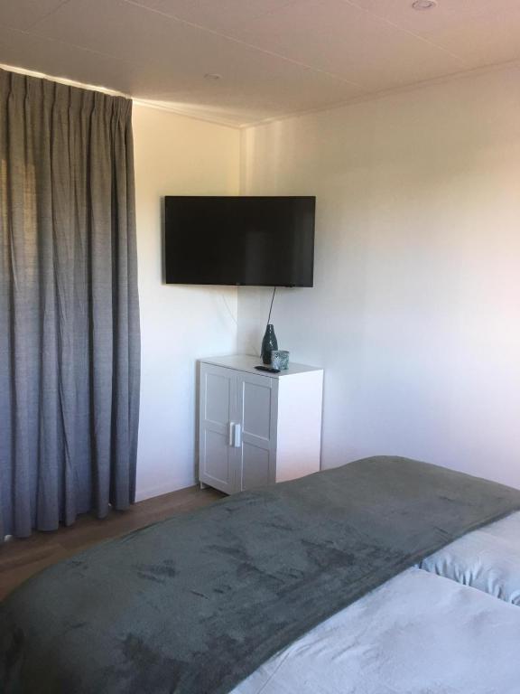 Postel nebo postele na pokoji v ubytování Luxury Lodge Veere