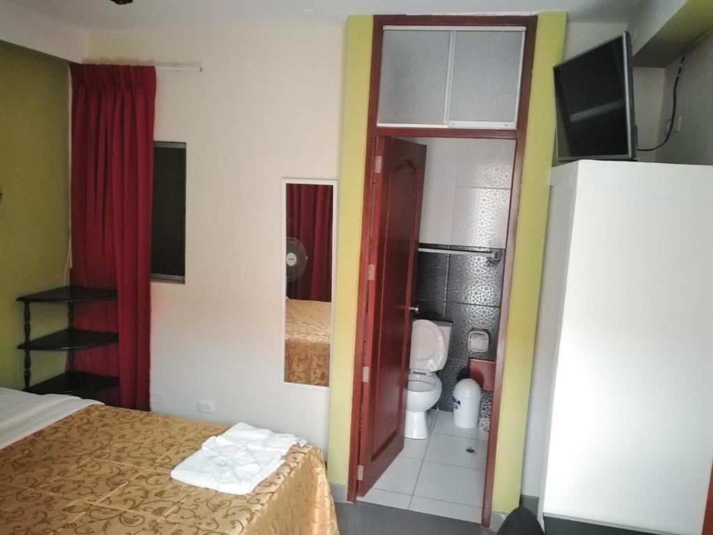 Postel nebo postele na pokoji v ubytování Hotel Plaza Bolognesi 344