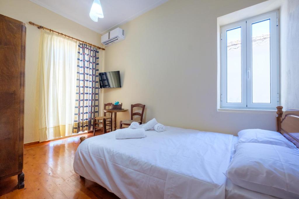 Postel nebo postele na pokoji v ubytování Annetas House