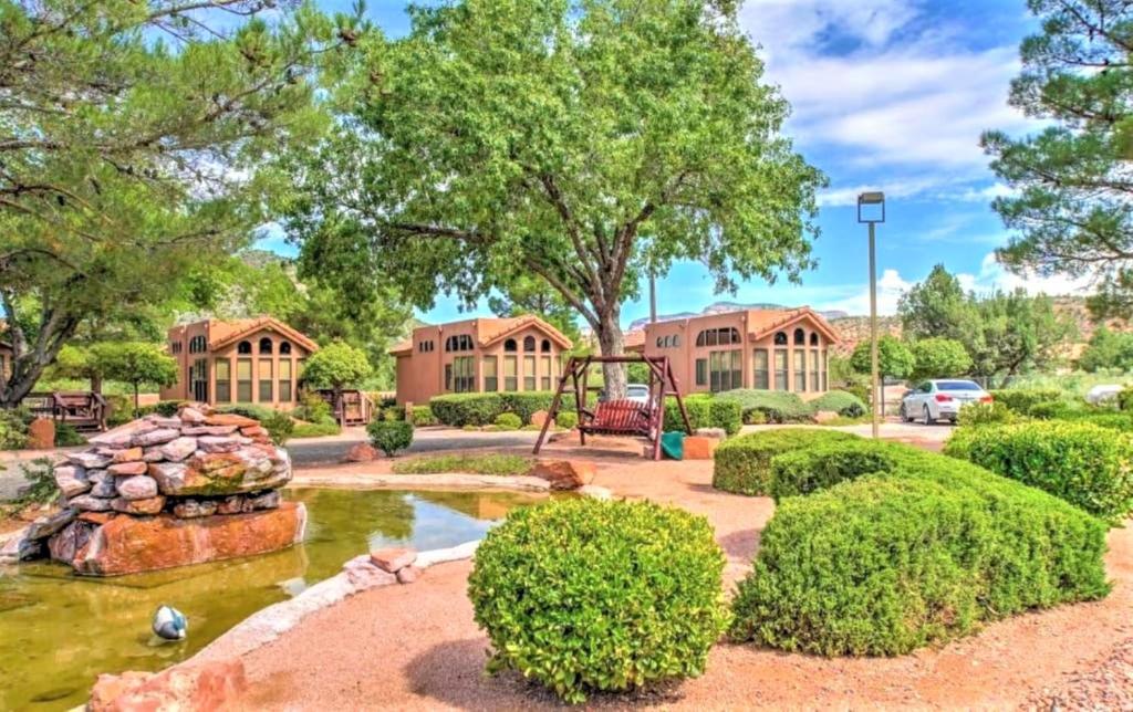 a yard with a pond and a playground at Sedona Pines Resort in Sedona