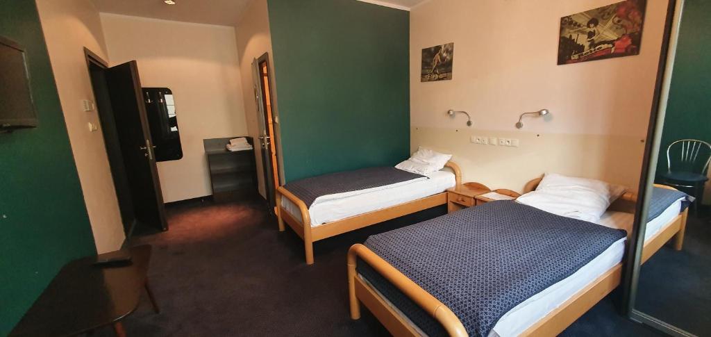 Postel nebo postele na pokoji v ubytování Pentagos