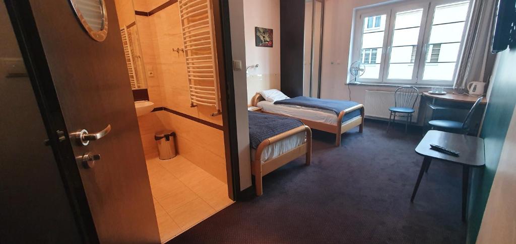 Postel nebo postele na pokoji v ubytování Pentagos
