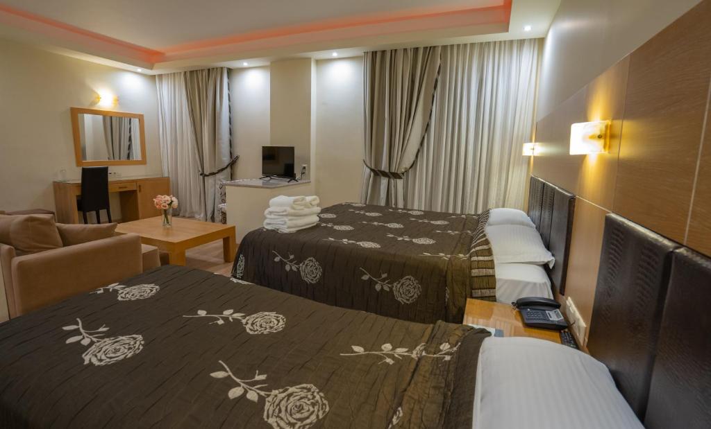 Postel nebo postele na pokoji v ubytování Pantelidis Hotel & Spa