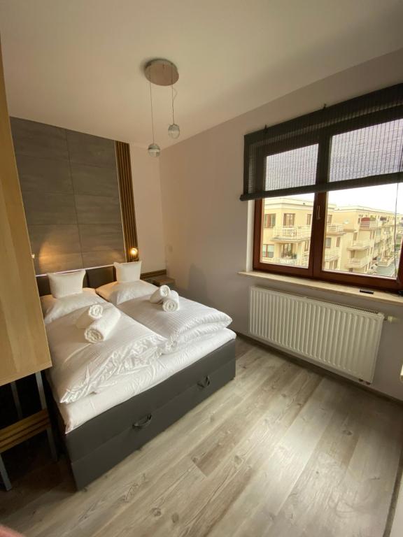 Postel nebo postele na pokoji v ubytování Apartament Drewno i Morze