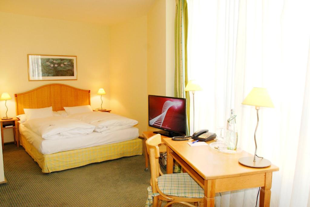 Postel nebo postele na pokoji v ubytování Hotel Leipzig City Nord by Campanile