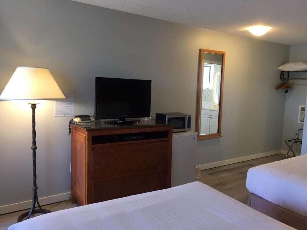 Postel nebo postele na pokoji v ubytování VIP Motel