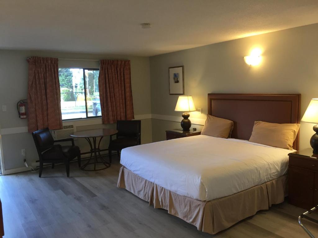 Postel nebo postele na pokoji v ubytování VIP Motel
