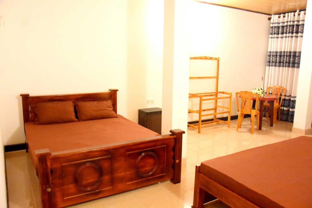 Postel nebo postele na pokoji v ubytování Wingate Hotel Wilgamuwa