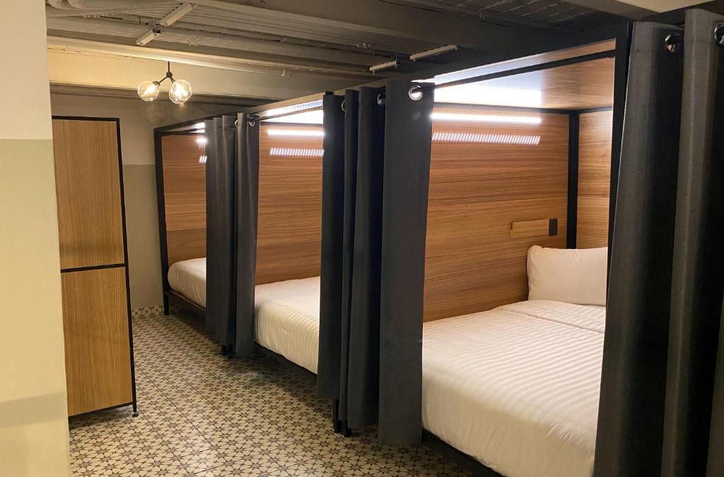 Postel nebo postele na pokoji v ubytování Hostal CASA MX centro