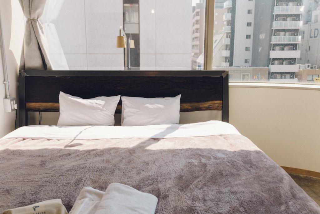 Postel nebo postele na pokoji v ubytování CITAN Hostel