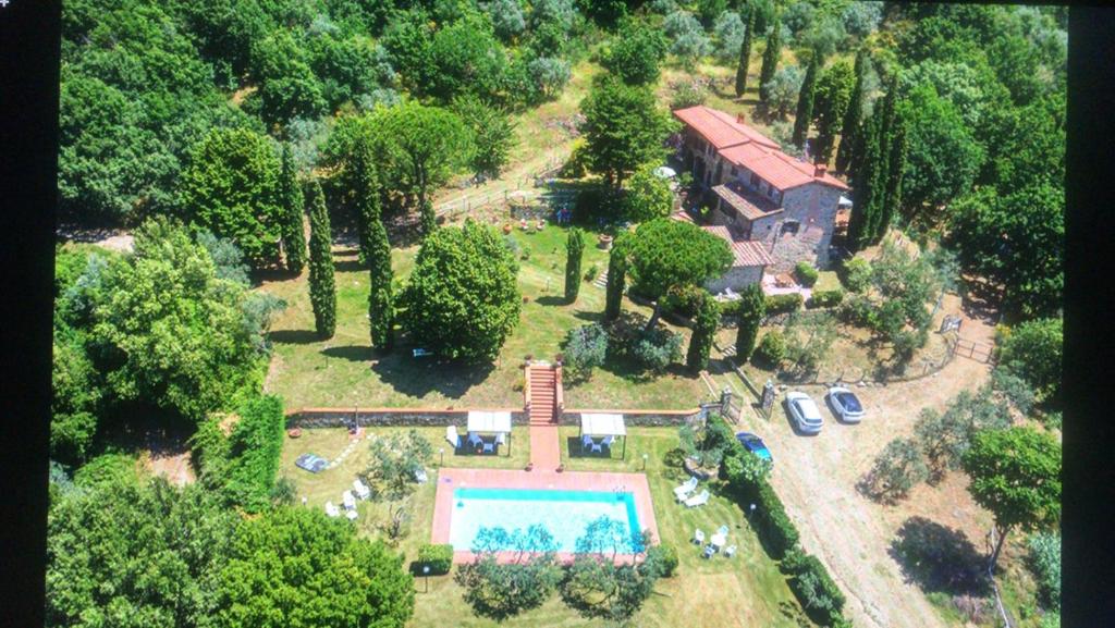 an aerial view of a house with a swimming pool at PODERE Piazza di Sopra in Reggello