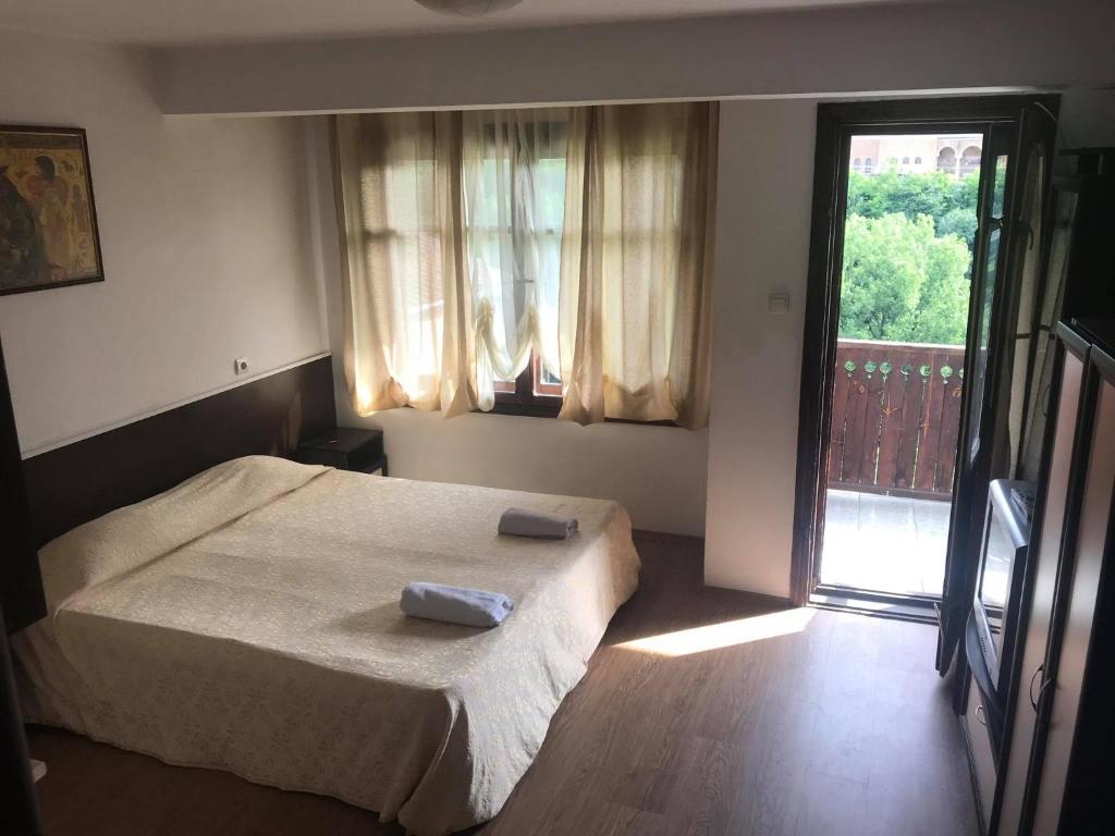 Postel nebo postele na pokoji v ubytování Guestrooms Ross