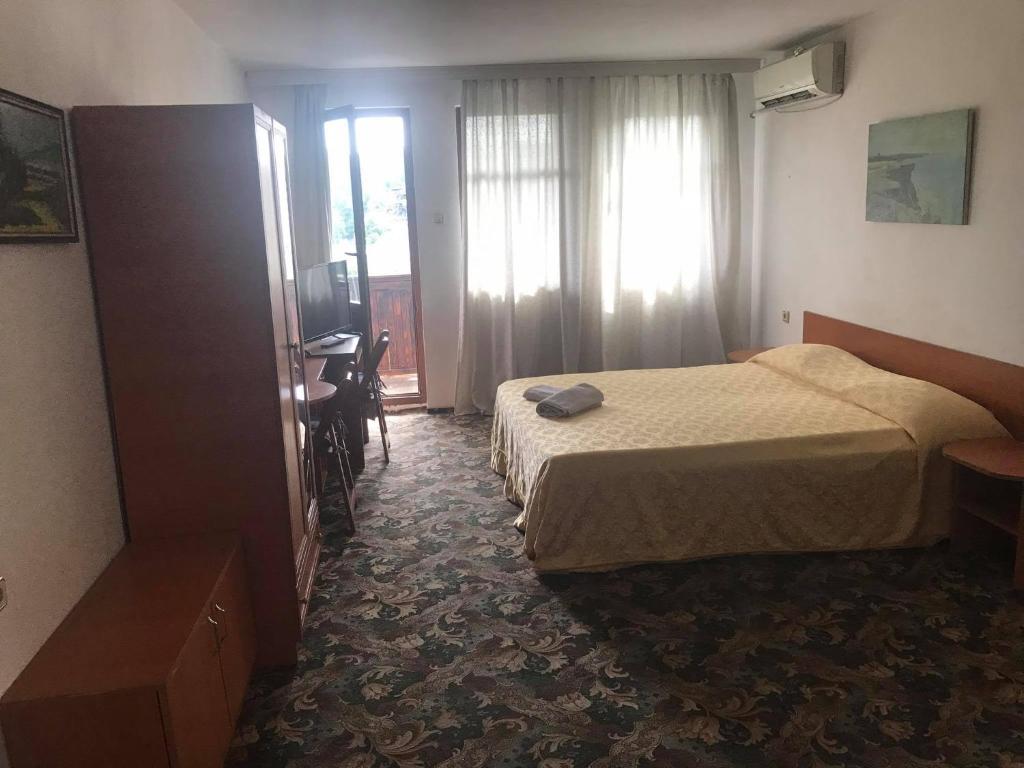 Postel nebo postele na pokoji v ubytování Guestrooms Ross