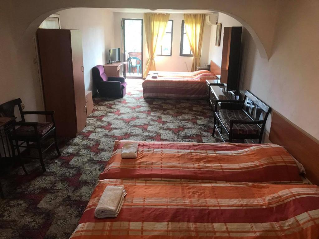 Postel nebo postele na pokoji v ubytování Guestrooms Ross