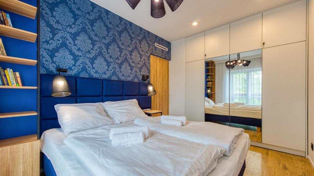 Posteľ alebo postele v izbe v ubytovaní Apartament 41 Holiday Mountain Residence - 5D Apartamenty