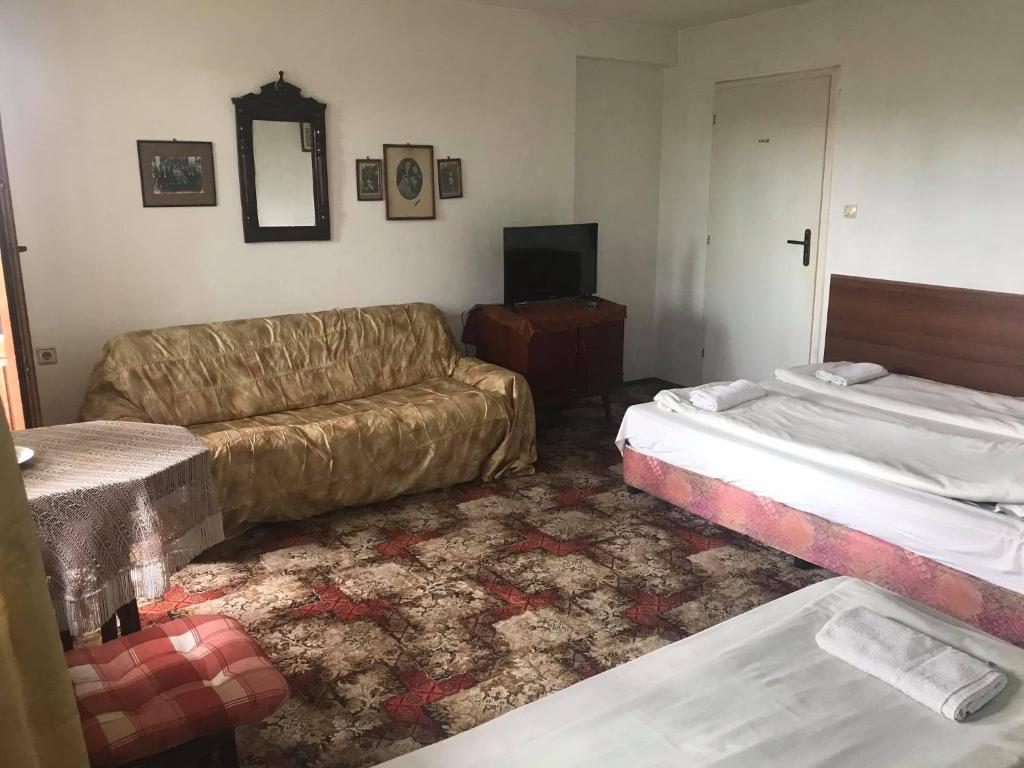 Postel nebo postele na pokoji v ubytování Guestrooms Ross