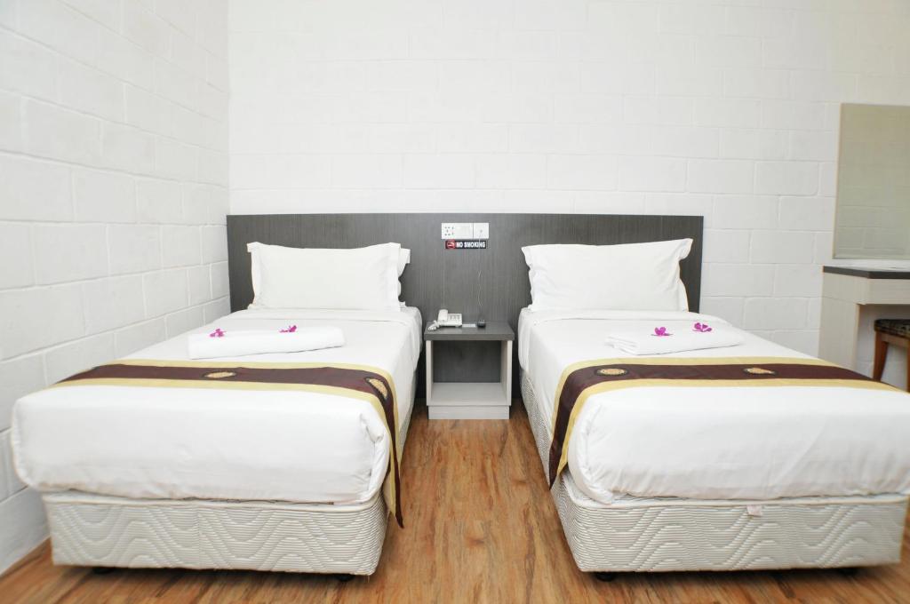 Postel nebo postele na pokoji v ubytování Promenade Service Apartment