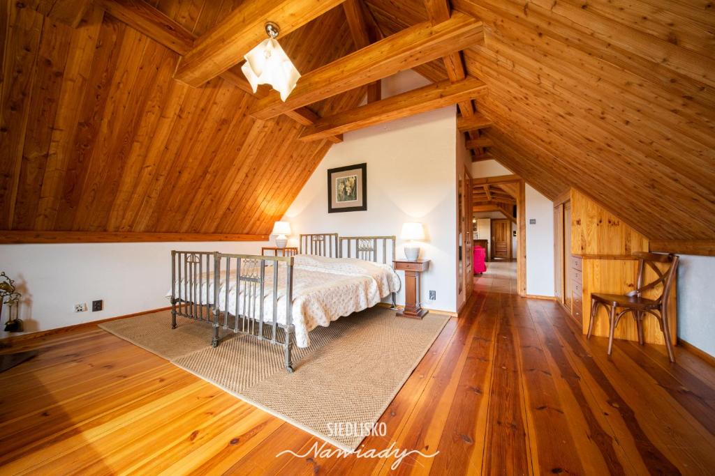 Postel nebo postele na pokoji v ubytování Siedlisko Nawiady - hotel butikowy