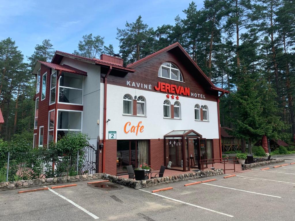 a building with a sign that reads kane urban cafe at Hotel Jerevan in Druskininkai