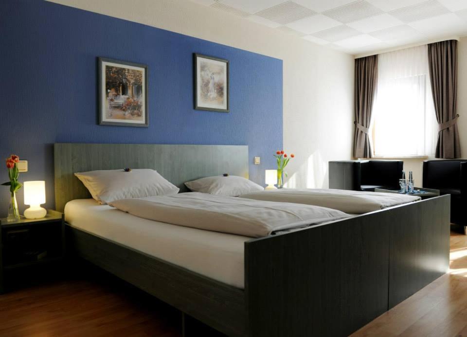 Postel nebo postele na pokoji v ubytování Hotel Restaurant zum Schlossberg
