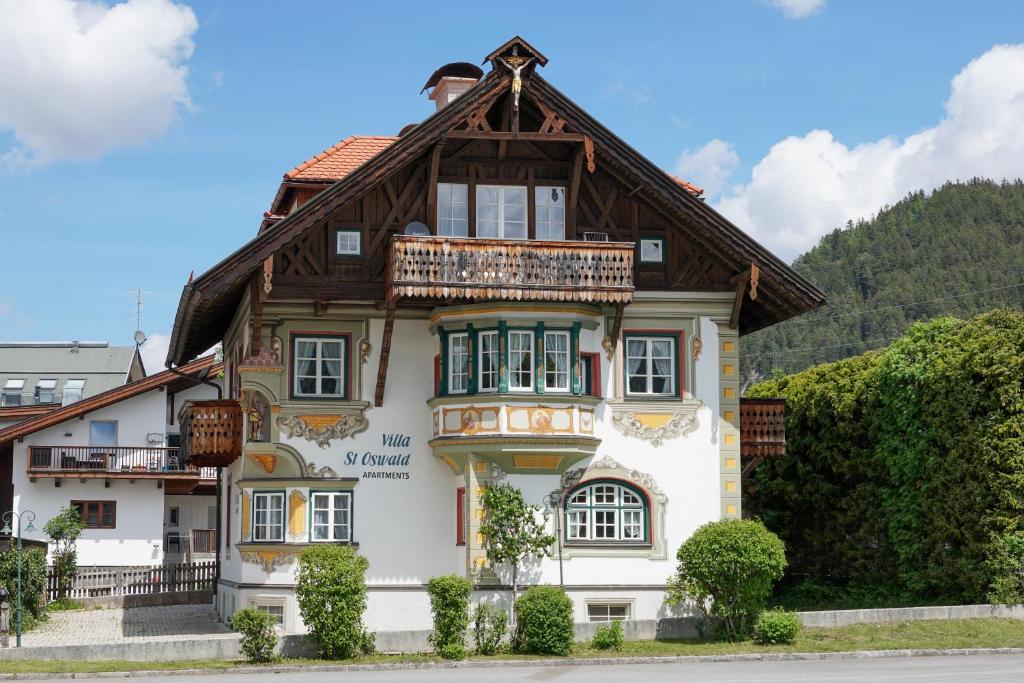 a house with a wooden roof at Villa St. Oswald in Seefeld in Tirol