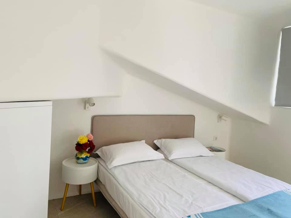 Postel nebo postele na pokoji v ubytování Friends Family Hotel