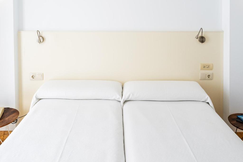 Łóżko lub łóżka w pokoju w obiekcie Hotel Ciudad de Cazorla