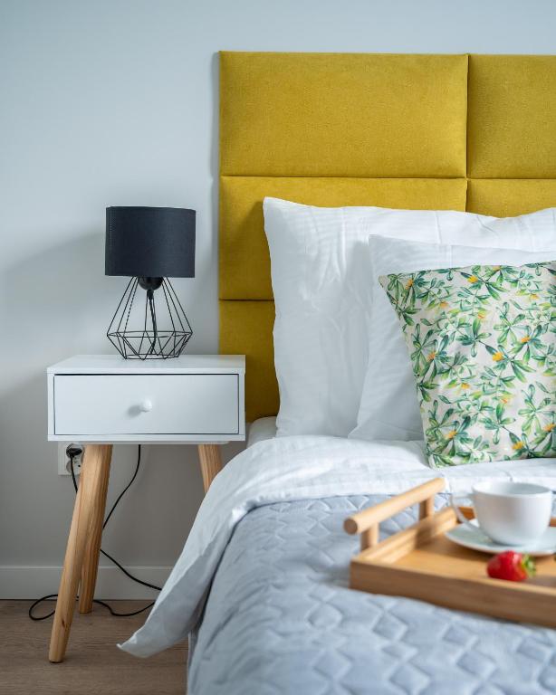 Posteľ alebo postele v izbe v ubytovaní MODUO Serviced Apartments