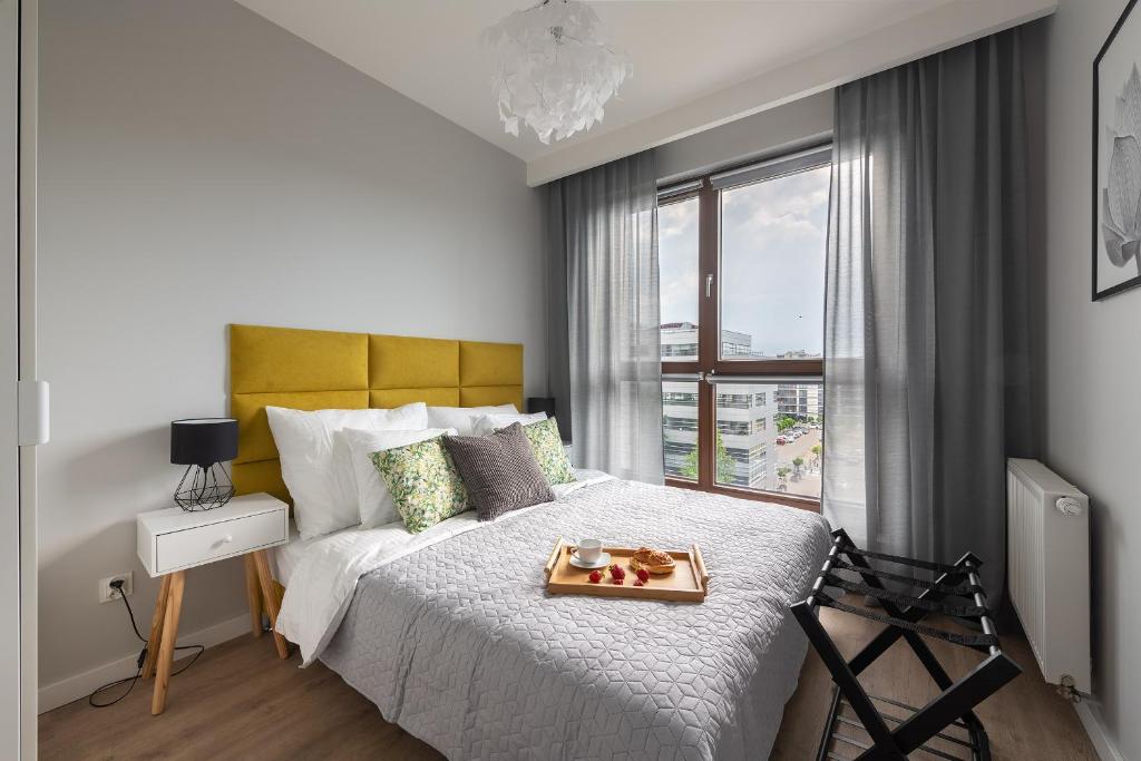 Posteľ alebo postele v izbe v ubytovaní MODUO Serviced Apartments