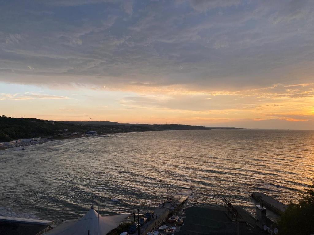 a view of a body of water at sunset at Erzurumlu Hotel in Kilyos