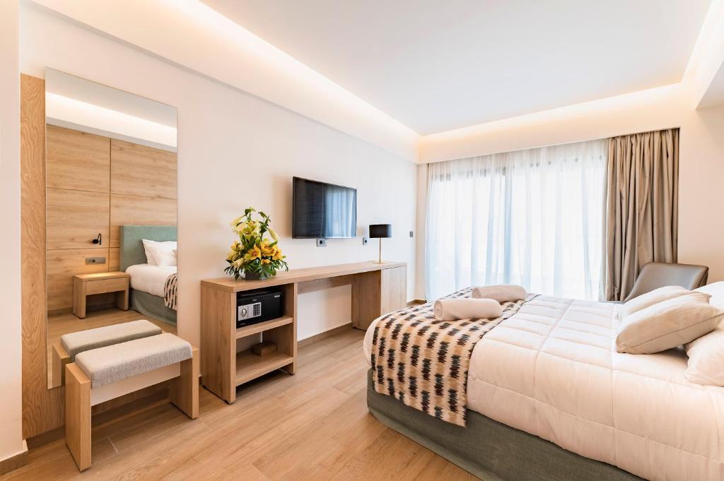 Postel nebo postele na pokoji v ubytování Acandia Hotel